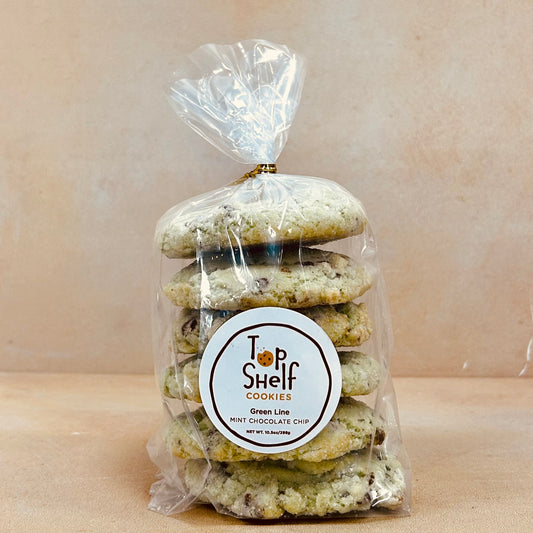 Packaged cookies with a 'Top Shelf Cookies' label on a beige background