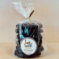 Packaged cookies labeled as Green Monster Mint from Top Shelf Cookies, visible through a clear plastic bag.